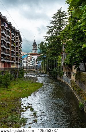 Traditional Houses In The Town Of Azkoitia Next To The Urola River And Church Of Santa María La Real