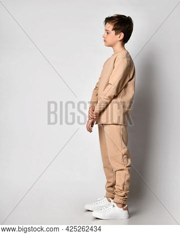 Serious Thoughtful Confident Preteen Boy Child In Fashion Sportswear Thinking Looking Forward On Cop