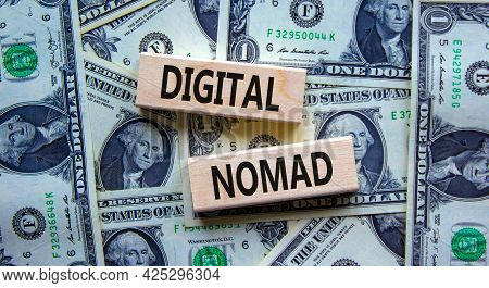 Digital Nomad Symbol. Wooden Blocks With Words Digital Nomad On Beautiful Background From Dollar Bil