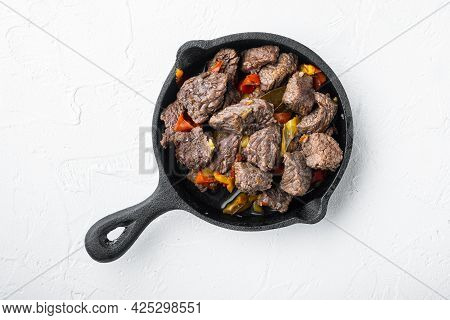 Goulash, Beef Stew Set, In Cast Iron Frying Pan, On White Stone  Surface, Top View Flat Lay
