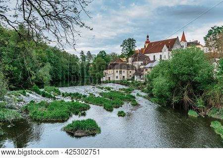 Spring View Of Beautiful Castle,waterfront Houses And Nezarka River With Weir In Town Of Straz Nad N