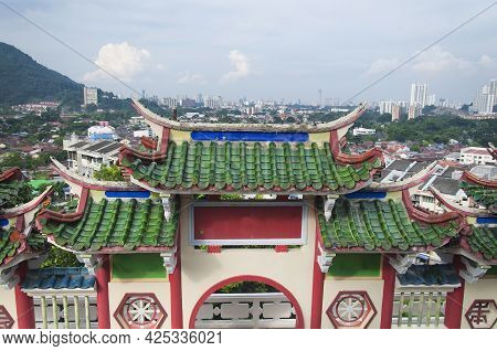 A Traditional Chinese Style Gate With The City Of Air Itam In Penang Malaysia In The Background.
