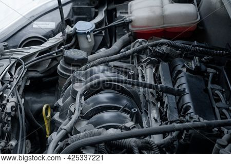 Motor Of An Auto Car With An Open Hood Lid