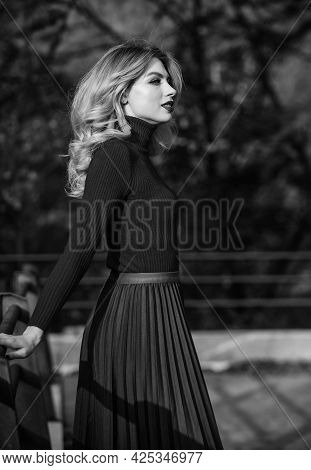 Feeling Free And Relaxed. Girl Long Blond Hair City Walk. Autumn Woman Curly Hair Outdoor. Haidresse