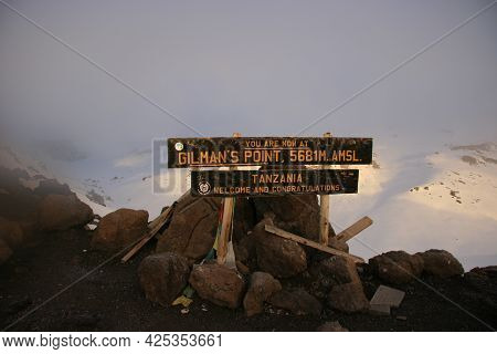 Gilmans Point Sign At Summit Of Mount Kilimanjaro Covered In Snow, Tanzania.