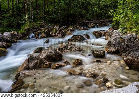 Magic Forest Zauberwald At Lake Hintersee With Creek Ramsauer Ache. National Park Berchtesgadener La