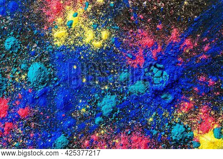 Top View Abstract Colorful Happy Holi Background. Color Vibrant Powder On Concrete. Colored Splash E