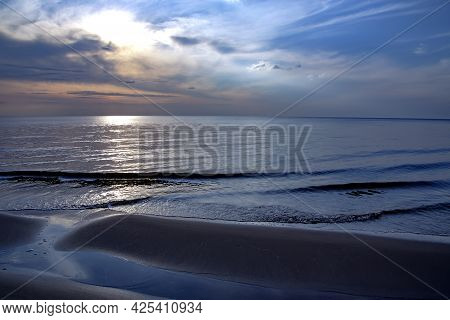 Panorama Of Wild Coast Of The Baltic Sea With Small Waves On Sunset In Carnikava, Latvia