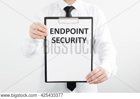 Endpoint Security Inscription On White Paper In The Hands Of A Businessman On A Light Background. Co