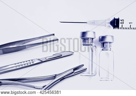 Vial Of Drugs Or Vaccine And 3 Ml Plastic Syringe With Needle Isolated On The White Background, Blue