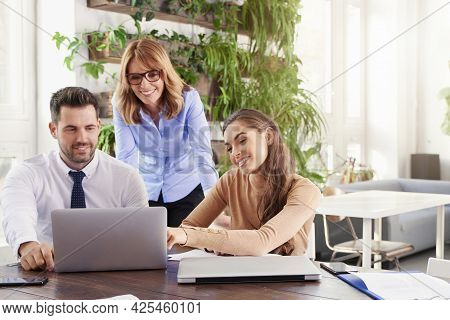 Group Of Business People Working Together On Business Project.  Young Secretary Woman And Financial 