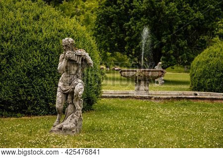 Valec, Western Bohemia, Czech Republic, 19 June 2021:  English Park With Tall Trees And Green Lawn, 
