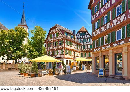 Mosbach, Germany - June 2021: Cafe With Empty Tables And Traditional Timber-framed Houses At Market 