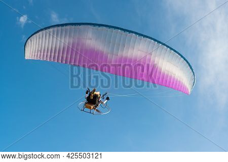 The People Was Playing A Paramotor Which Small Aircraft, Flying On The Blue Sky, Beautiful Nature Ba