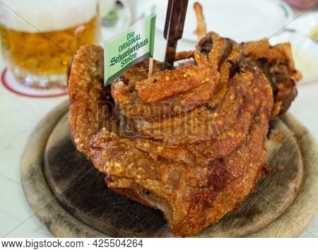 Vienna, Austria - June 4 2021: Roast Rear Knuckle Of Pork At The Schweizerhaus Inn And Beer Garden I