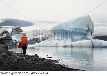 Woman at glacial lagoon in southeastern Iceland