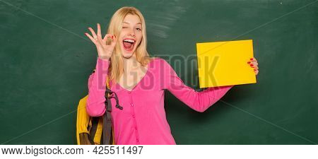 Excited Amazed Teacher. Student Girl Holding Empty Faper For Product. Portrait Of Smiling Female Tea