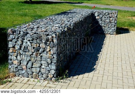 In The Park There Are Benches In The Lee Of The Gabion Walls Which Are Wire And Filled With Stones. 