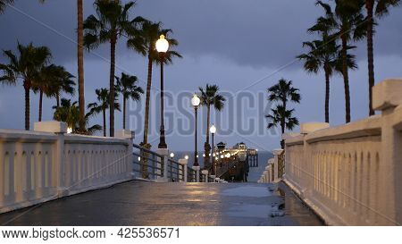 Rain Drops, Evening Dark Sky With Clouds, Oceanside California Usa. Empty Pier And Palm Trees In Twi