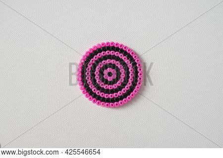Thermomosaic Ready-made Figurines In The Form Pink And Black Circle On White Background