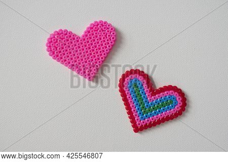 Thermo Mosaic Ready-made Figurines In The Form Hearts Colorful And Pink On White Background