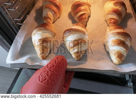Croissant Unbaked Fresh In Oven With Baking Paper For Homemade Breakfast