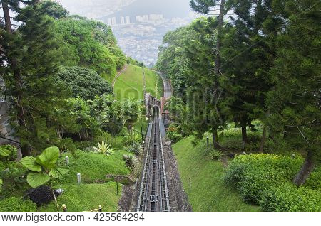 The Penang Hill Tram Tracks And The City Of Air Itam, Penang Malaysia Seen From An Aerial View From 