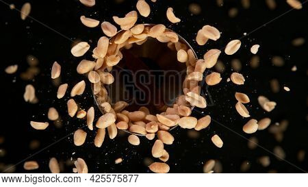 Rotating Peanuts on Black Background. Top Shot.