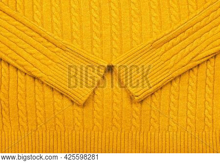 Close Up Background Texture Of Warm Yellow Cable Knitted Wool Jersey Fabric Sweater With Row Braid P