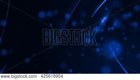 Glowing blue beams of light curving on black background with defocussed blue spots. lght, colour, energy and movement concept, digitally generated image.
