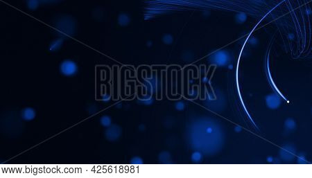 Glowing blue beams of light curving on black background with defocussed blue spots. lght, colour, energy and movement concept, digitally generated image.