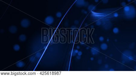 Glowing blue beams of light curving on black background with defocussed blue spots. lght, colour, energy and movement concept, digitally generated image.