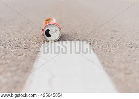 Aluminum Can Is Flat Lay,lying On The Road. Can Fall On The Street, It Can Be Recycled.summer Day Bl