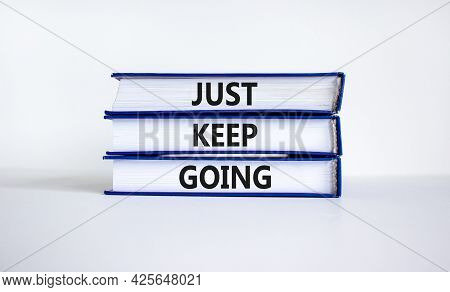 Just Keep Going Symbol. Books With Words 'just Keep Going'. Beautiful White Background. Business, Ju