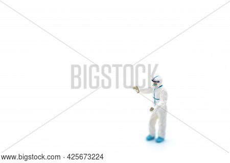 Healthcare And Pandemic Consept. Doctor Miniature Figure People Wearing Personal Protective Equipmen