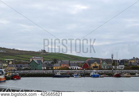 Fun Colored Houses Along The Harbor Of Dingle Ireland.