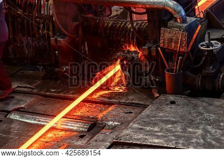 The Process Of Rolling Hot Rolled Steel In A Rolling Mill.