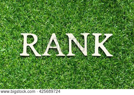 Alphabet Letter In Word Rank On Green Grass Background