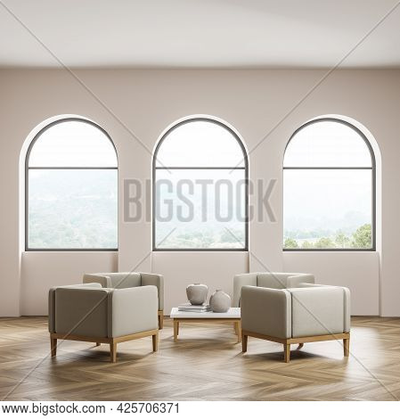 Waiting Room Interior. Thee Arch Windows With Attractive Scenery In Wall Recesses. Four Beige Armcha