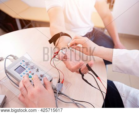 Patient Nerves Testing Using Electromyography At Medical Center