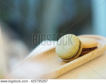 Macaron Flavor Green Tea And Coffee In Wooden Tray Plate Shape Ellipse, Dessert Snacks Afternoon On 