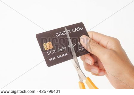 Cutting Credit Card With Scissors  On White Background. Solve Problems Extravagant Spending. Stop Pa
