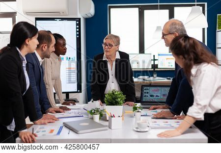Diverse Colleagues Businesspeople Discussing Company Issue During Start Up Meeting Sitting In Broadr