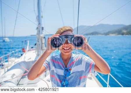 Little Boy On Board Of Sailing Yacht On Summer Cruise. Travel Adventure, Yachting With Child On Fami