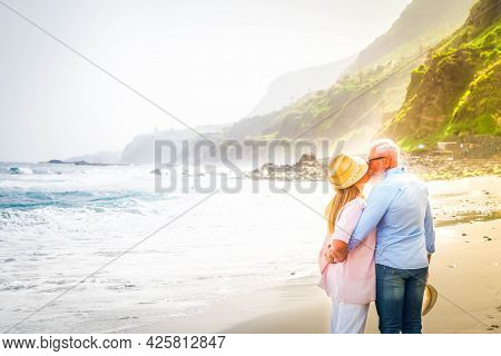 Lifestyle Of Caucasian Senior Couple Kissing On Beach, Happy In Love Romantic And Relax Time, Touris