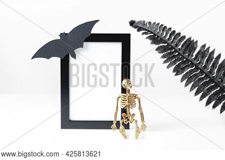 Black Vertical Frame Mockup. Styled Stock Photography. Halloween Concept With Stylish Details Skelet