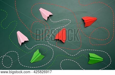 Group Of Paper Planes With Long Tangled Paths On A Green Background. Concept Of A Strong Leader With