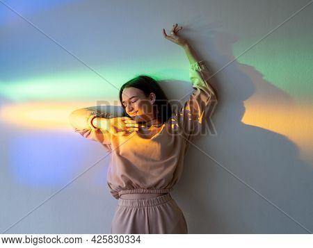 Neon Light Woman. Positive Lifestyle. Carefree Joy. Happy Youth. Cheerful Smiling Girl Relaxing Enjo