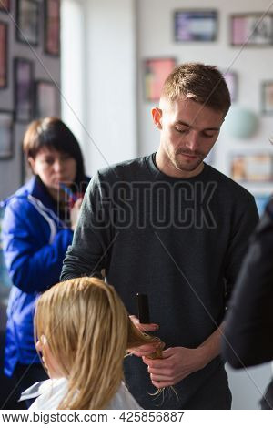Keune Brand Technologist Artem Raychuk Dyes The Hair Of A Model On Advertising Workshop