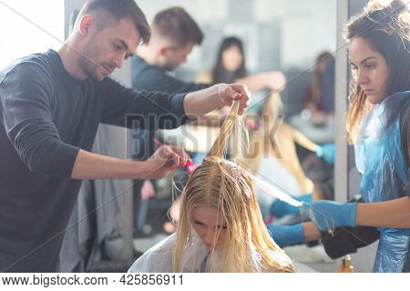 Keune Brand Technologist Artem Raychuk Dyes The Hair Of A Model On Advertising Workshop